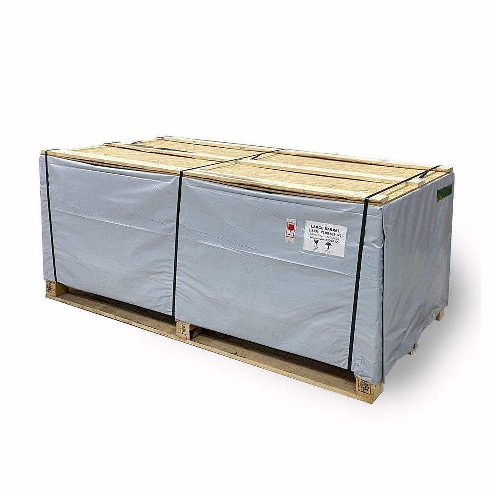 Wooden pallet with large box wrapped in gray covering on a white background